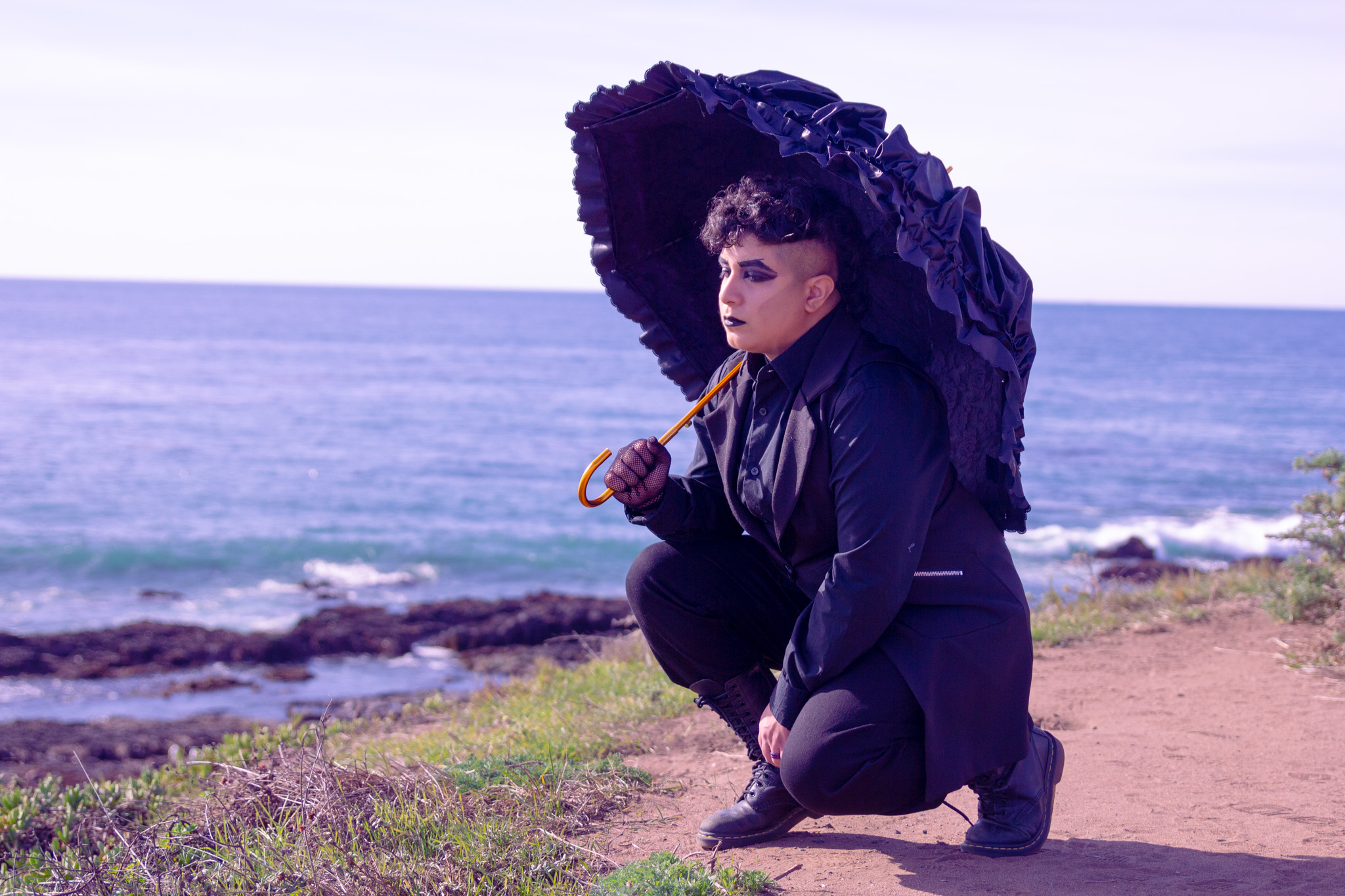 Me in all black, holding a lacy umbrella, contemplating the seaside in Cambria